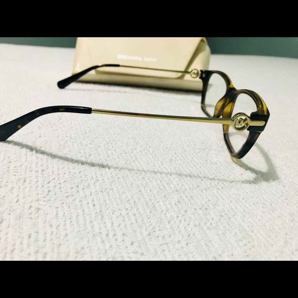 Michael Kors glasses.